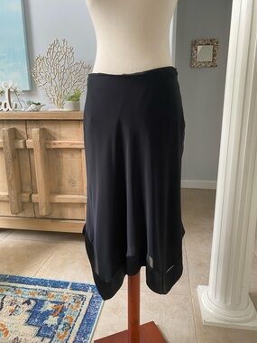 Patra Black Midi Skirt with Subtle Hem Detail